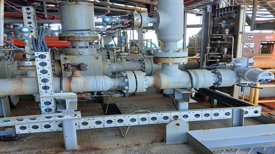 Industrial piping, valves, and a Rotork actuator on an offshore energy platform